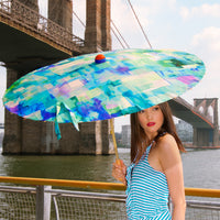 Woman holding Lily Lark Blue Squares handcrafted UV Sun Parasol