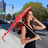 Woman standing with Lily Lark Coral Roses Handcrafted UV sun Parasol